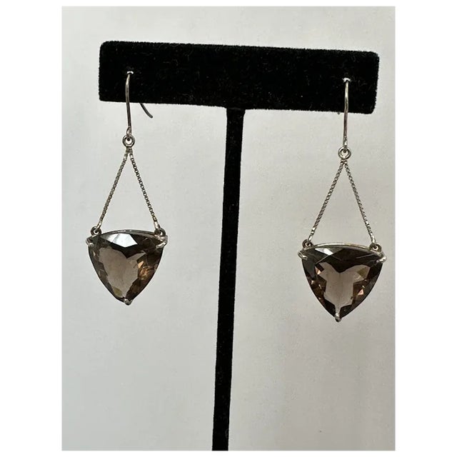 Unique, designer earrings with trillion shaped quartz suspended from two box chains. Wonderful facets and sparkle. Measure...