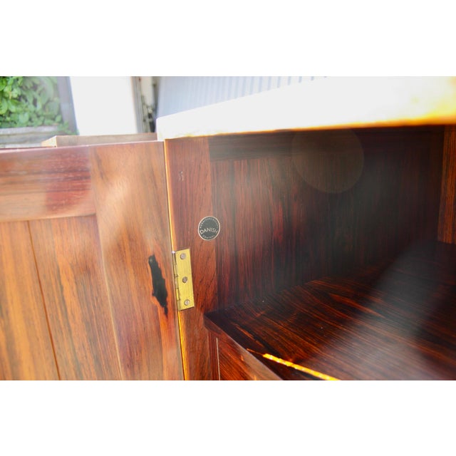 Rare rosewood cabinet by Danish designer Kurt Ostervig, produced by Vamo Sonderborg in 1960. Beautifully crafted, with a...