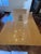 A statement dining table in high-gloss bird’s-eye maple, built with the kind of veneer work you don’t see outside custom...