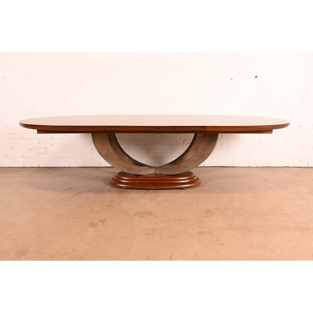 An exceptional Modern Art Deco pedestal extension dining table By Henredon, "Omni Collection" USA, Circa 1980s Carved ash...