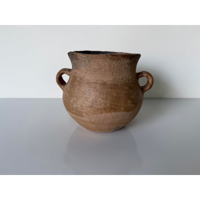 A beautifully rustic vintage primitive organic style art pottery vase featuring a sculptural hand-thrown form and earthy...