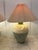 This pair of lamps was made in California by the Casual Lamp Co. in 1988. The textural linen shades and painted finials...