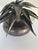 Sculptural Agave Metal Lamp Aged Bronze Finish. Layered in metal leaves on top of round base with dark finish. Showroom...