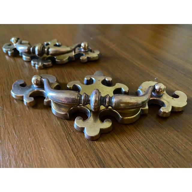 Set of 4 vintage Chippendale style brass drawer pulls. Two larger and two slightly smaller. Substantial profile. Ideal for...