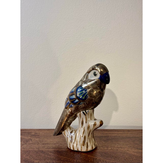 A charming vintage Tonalá Mexican folk art parrot figurine featuring hand-painted ceramic accented with articulated...