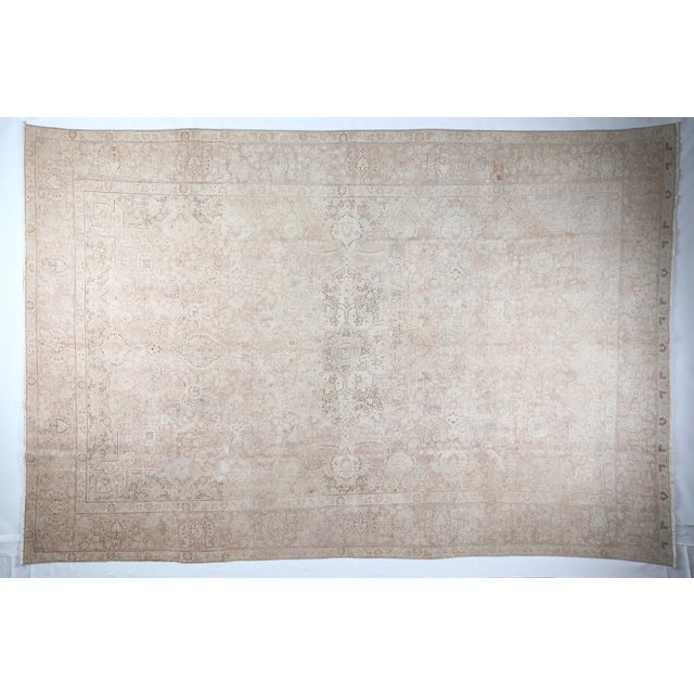 This beautiful tribal vintage Persian Tabriz rug showcases a beautifully balanced color combination and the sophisticated...