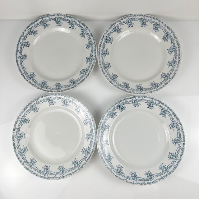 Set of 4 St. Amand semi-deep plates, circa 1930 Double floral frieze decoration, blue/green Dimensions: Diameter: 22.5 cm...