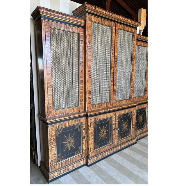 Fabulously chic faux painted bookcase with grillwork doors and coral interior. This piece was custom hand painted at some...