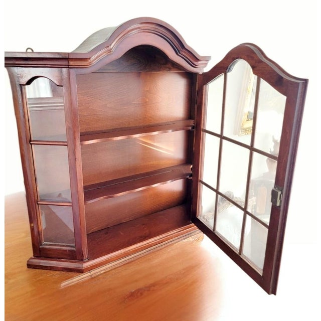 Elegant mid-century Dutch wall-mounted display cabinet / glazed curio vitrine, made in the Netherlands and dating from...