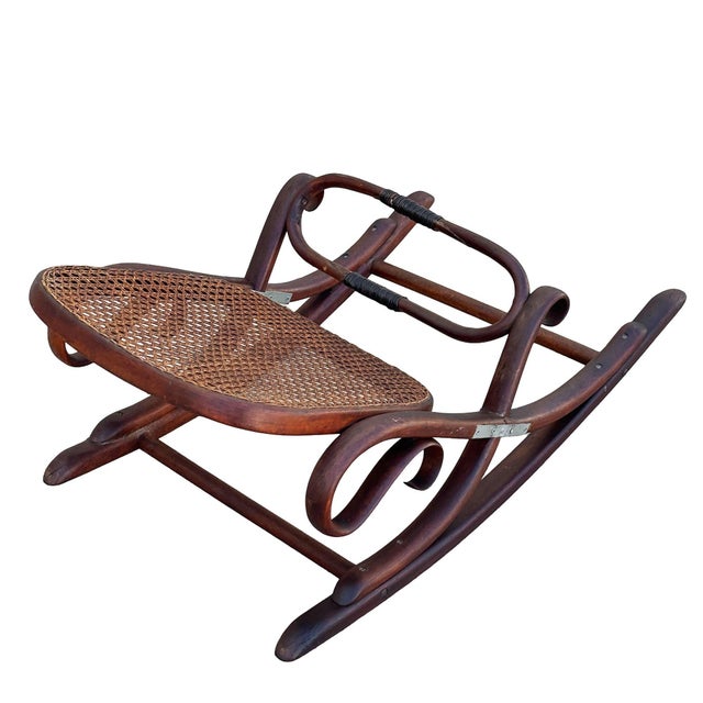 Victorian Thonet No.7001 rocking chair foot stool featuring an elegant, sculptural frame crafted from warm-toned bentwood...