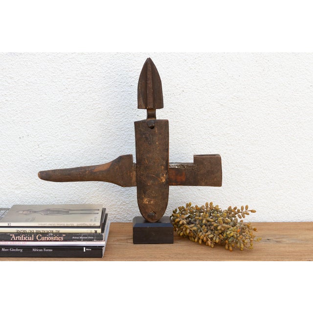 This antique tribal door lock, hand-carved from wood in Mali, Africa, is more than just a functional object; it's a...