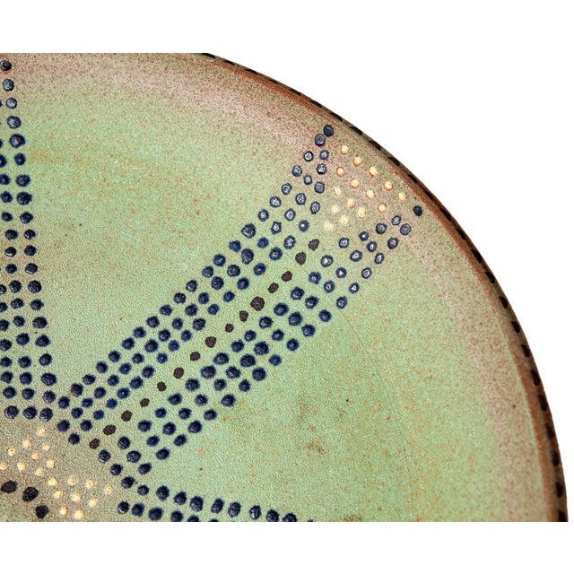 A Unique Vintage Pale Green Artisan Ceramic Platter with Tribal Dot Design. A Handcrafted Piece with Mid-Century Vibes.