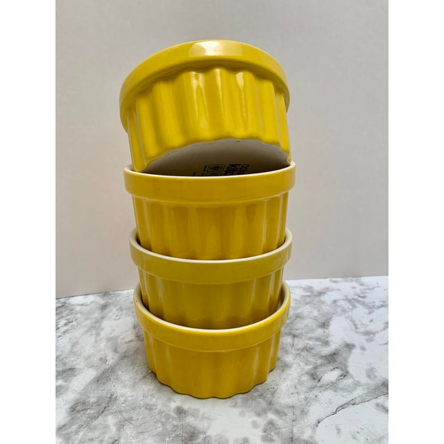 Vintage yellow and white set of four ribbed textured ramekins. Excellent for serving nuts, sauces and more.