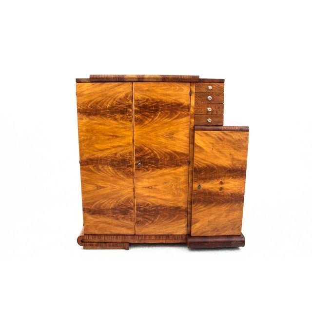 Art deco sideboard/bar cabinet from the mid-20th century. the piece features four small drawers, one large, spacious...