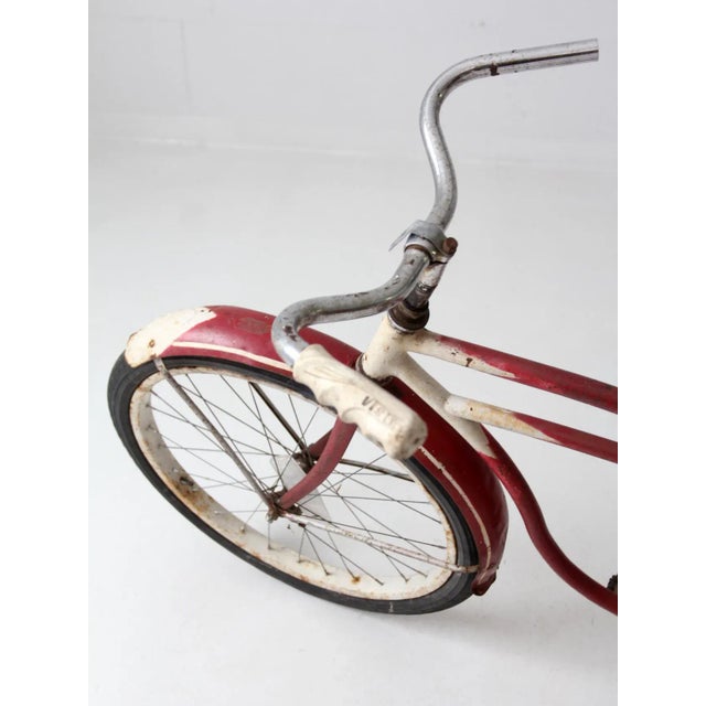 Decked out in red, white, and blue, this is a vintage Americana bicycle circa 1930s - 1950s. The well-worn bicycle is a...