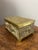 A charming vintage English brass repoussé footed box, richly decorated with a delightful dog motif. Each side of the box...