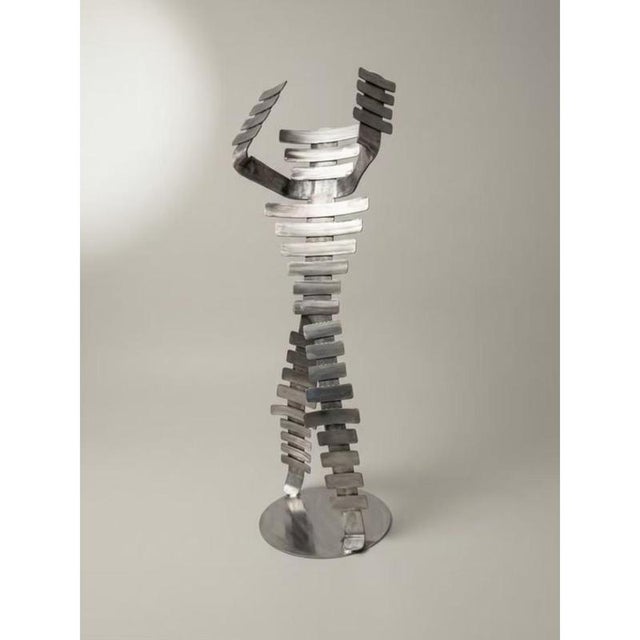 A mad man sculptural statue in stainless steel by metalmorphosis studio dimensions: d 40 x w 50 x h 160 cm. Materials:...