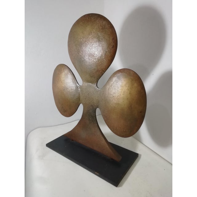 Characteristic welded metal decorative object featuring a stylized flower. Two parts were welded and then attached to a...