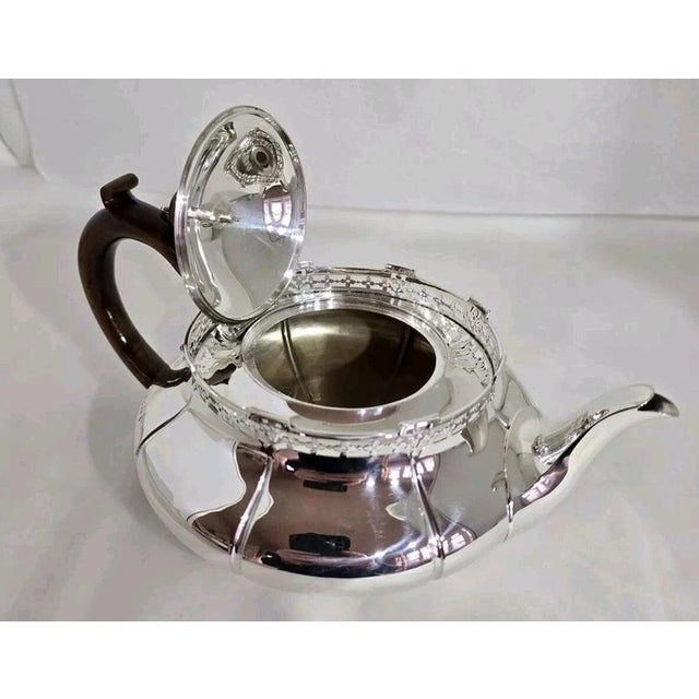 A fine george v sterling silver teapot dating to 1912, designed in the georgian style and displaying elegant early 20th-...