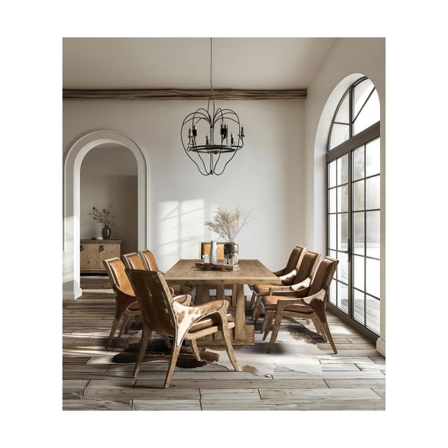 Dining table with Arched Pedestal Base. Crafted from solid wood, this expansive rectangular table features a sculptural...