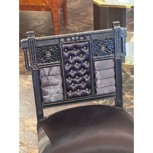 Very fine early 20th century Chinese lacquered chair. Featuring beautiful carvings and gilt accents with rolled and tufted...