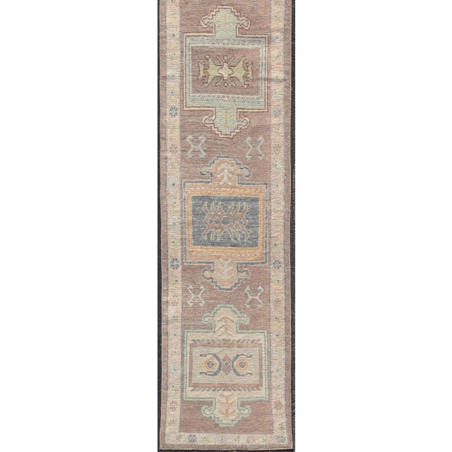 Measures: 2'11 x 23 Long Turkish Oushak Runner in Pale Taupe with Blue and Soft Green Motifs. Keivan Woven Arts. rug...