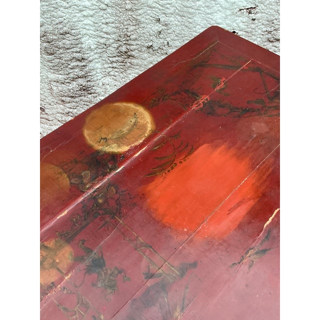 Elevate your decor with this vintage Asian lacquered chinoiserie side table. Featuring exquisite hand-painted scenes...