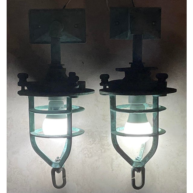 These captivating Bronze Nautical Marine Wall Sconces, likely once serving as robust convoy lights, stand as a testament...