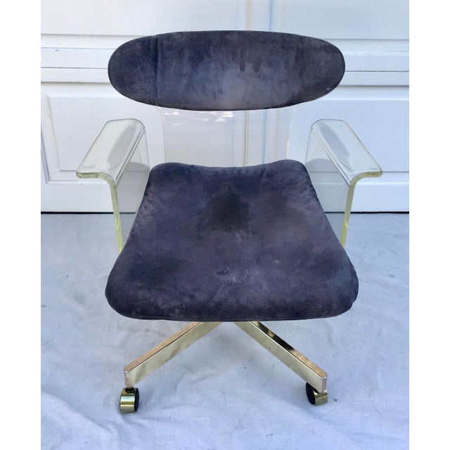 This is a STUNNING chair from the 1960's made of molded lucite complete with an oval shaped backrest and swan-like...