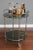 Vintage brass food trolley with glass shelves and rubber-coated swivel wheels. In perfect condition. No chips on the...