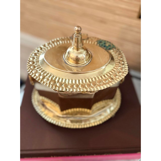 Antique Large brass footed and lidded box. It measures 9 by 7 by 8.5 inches. It has handles on the side. It does have a...