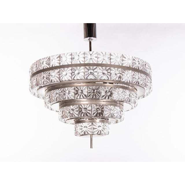 Stunning large five-tier chandelier with heavy crystal glass elements on a nickel frame. Crystal glasses resemble...