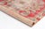 This is a vintage Turkish Oushak rug from the Mid 20th Century. The piece was hand-knotted.