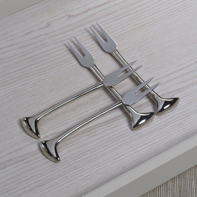 A refined addition to any cocktail or cheese board presentation, this set of four stainless steel and brass forks features...