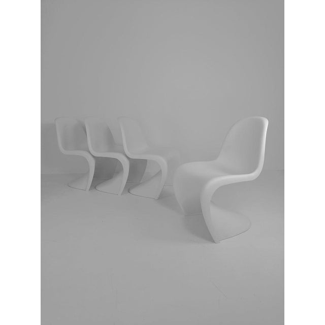 4 x Verner Panton chairs in white from Vitra Germany Designer Panton, Verner Dimensions H85 x W49 x D50 color white...