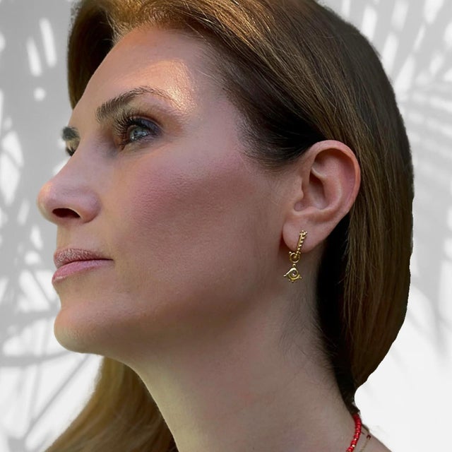 Evil Eye Sterling Silver Tourmaline Gemstone Gold Earring is a captivating fusion of ancient symbolism and modern...