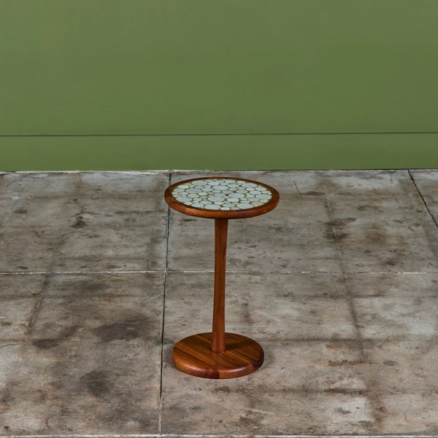 Round side table by Gordon & Jane Martz. The table top is inlaid with cement gray speckled ceramic coin tiles. The frame,...