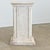 A square display pedestal from France, late 19th century, coated in plaster as a hand-made finish to mimic the qualities...