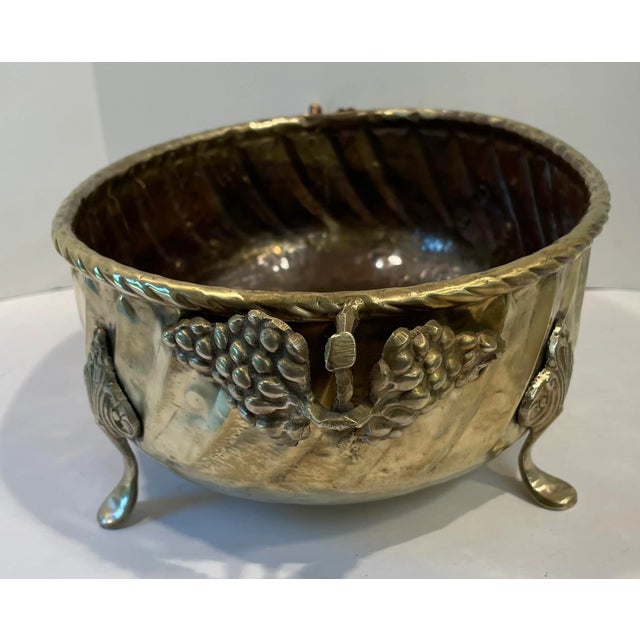 Nice vintage hammered brass planter, oval shaped with grape design side handles. Nice!