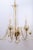 This is a graceful Venetian chandelier featuring sweeping glass S-arms and delicate, tulip-shaped candle cups. The fluid...