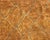 A vast field of sun-baked earth, traced with a whisper of diamonds. This hand-knotted wool rug spans a monumental scale in...