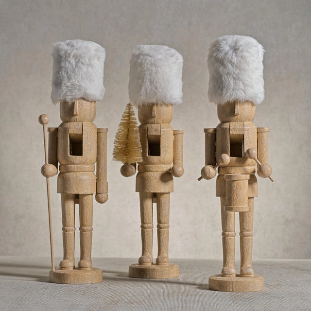 Discover the charm of the Ortwin Resin Nutcracker Figurines with Fur Hat, a unique blend of traditional design and...