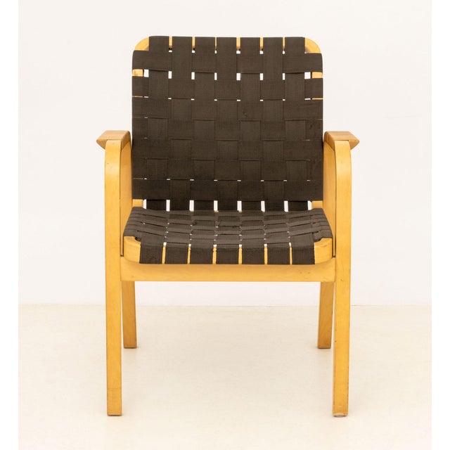 Alvar Aalto Model 45 Bentwood Arm Chair, originally designed 1947, bent birch frame, rattan wrapped arms, and grey webbing...