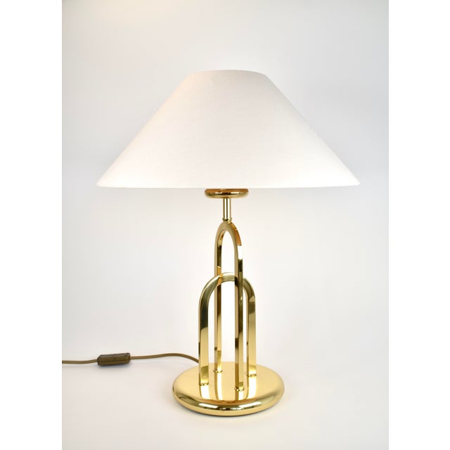 Rare brass table light from the end of the 1970s, beginning of the 1980s. The lamp has a very interesting design and is in...