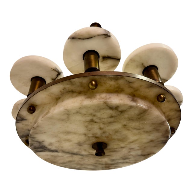 An elegant alabaster and brass ceiling light dating from early to mid-20th century, executed in a refined modernist style....