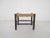About this item Small wooden (foot) stool with rattan seating. The wood has been painted dark brown.