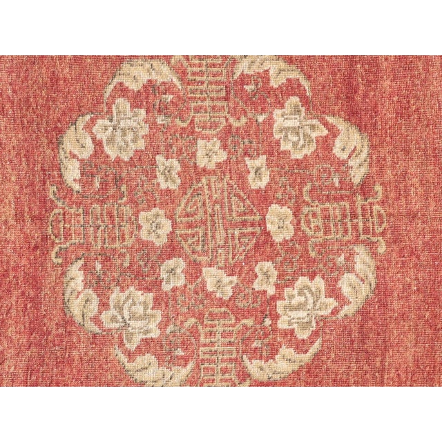 This vintage Turkish Oushak rug, measuring 5'8" x 9'6", is meticulously handwoven with wool on a wool foundation in the...