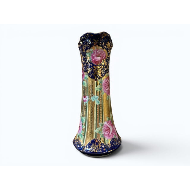 An antique Japanese Nippon porcelain tankard. Unsigned. The age is estimated to be ca 1910. Floral motif with extensive...