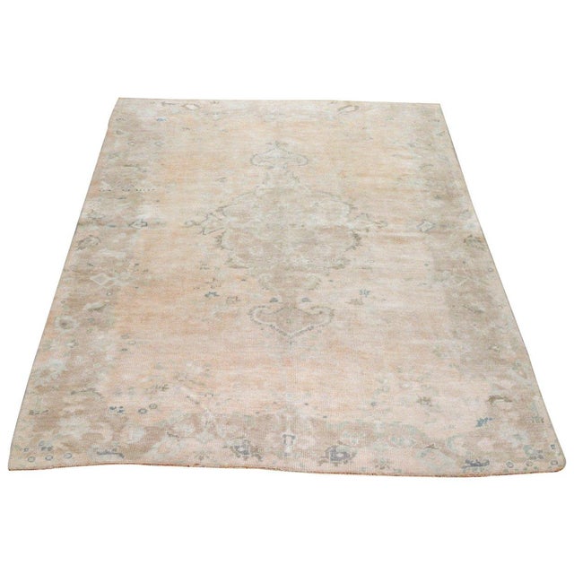 Hand-knotted with care using traditional rug-making techniques, this wool rug blends timeless craftsmanship with a modern...