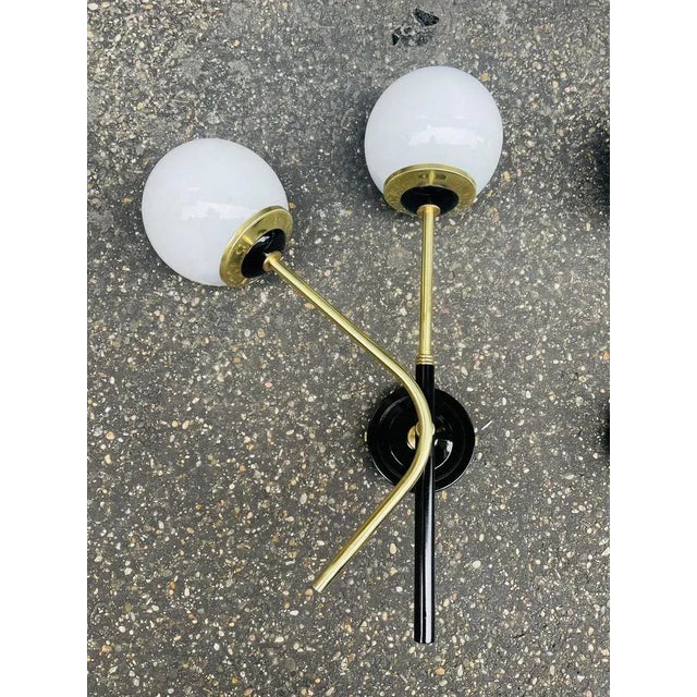 Very rare applique Stilnovo, published, in perfect condition, completely restored, all in brass with white opal I have...